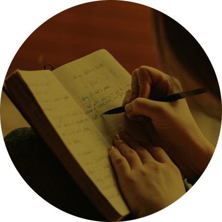 A person takes notes