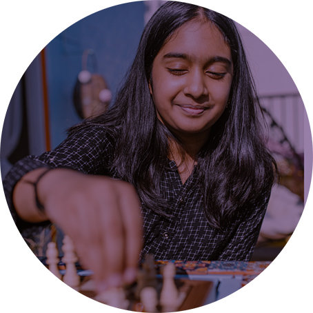 A person plays chess