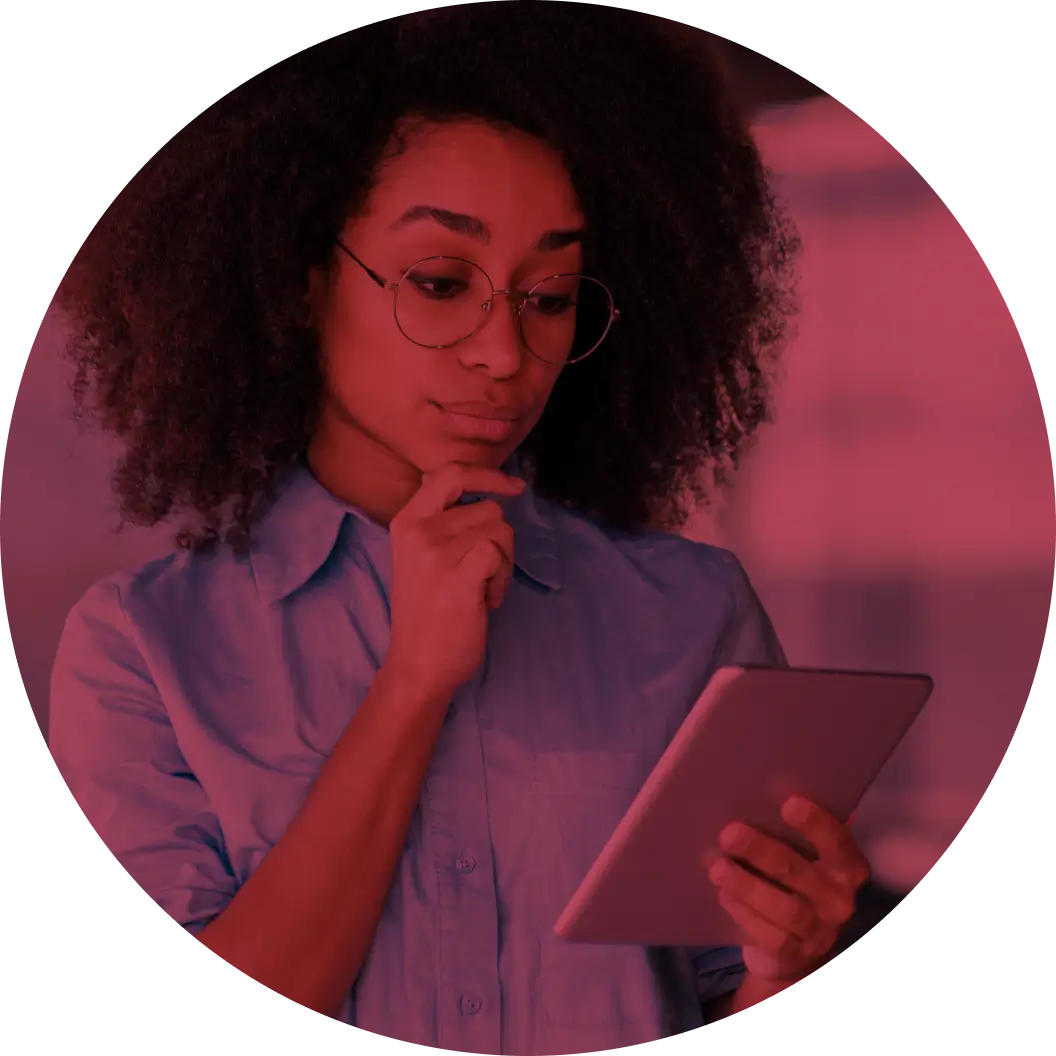 A person looks intently at an iPad